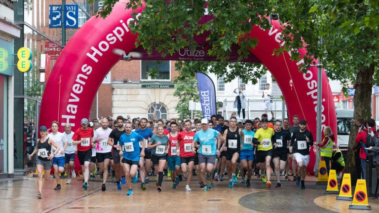 Runners setting off for their Race4Business run in Chelmsford High Street