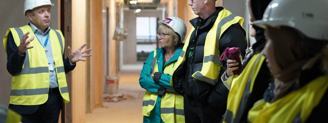 CEO Steve Smith and members of staff taking a tour of the new Fair Havens