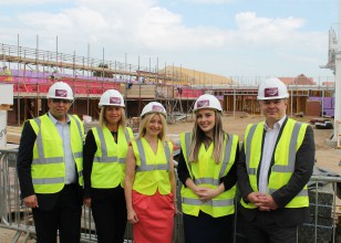 corporate supporters standing in front of the new Fair Havens building site