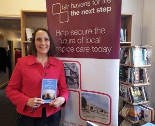 Jane Guest holding her book