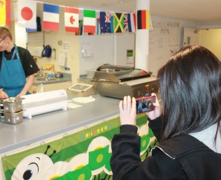 Zandra taking photos in the kitchen
