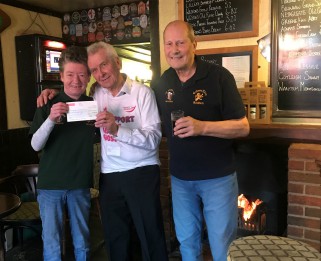 Staff at the Golden Lion handing over their cheque to Little Havens