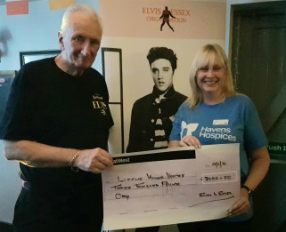 Elvis club giving cheque to community fundraiser