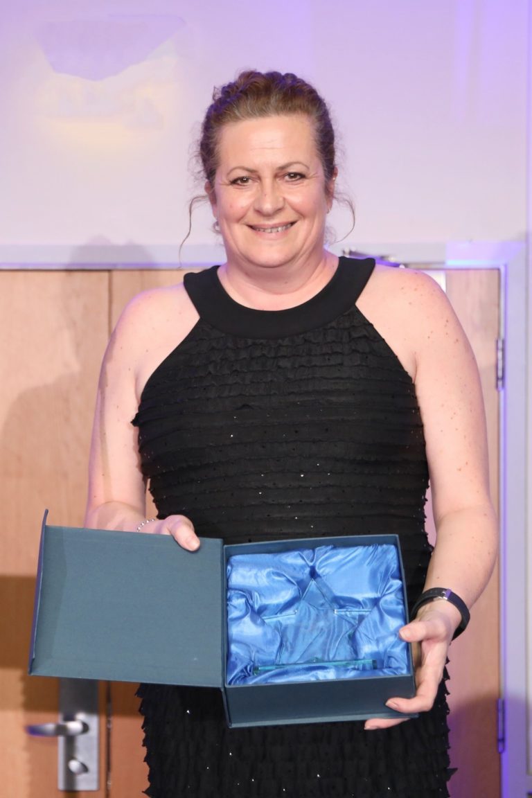 Event Fundraiser Jane accepting the award