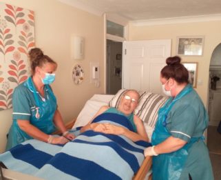 Alan receiving care in his home from the Fair Havens Hospice at Home Nursing Assistant