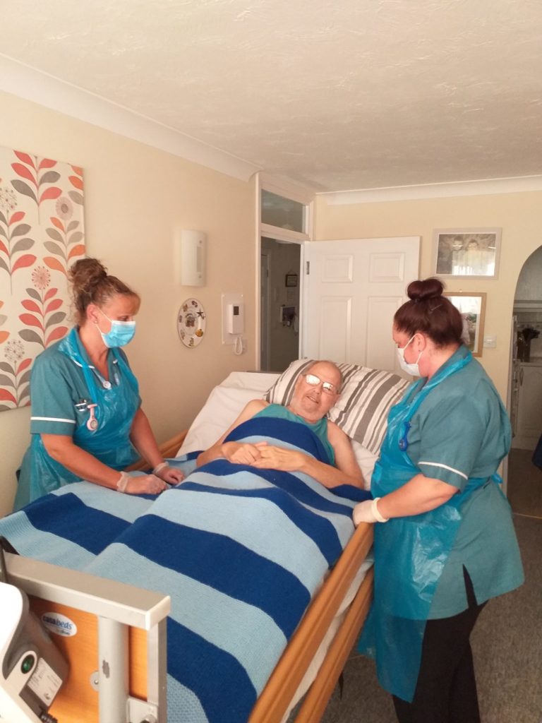 Alan receiving care in his home from the Fair Havens Hospice at Home Nursing Assistant