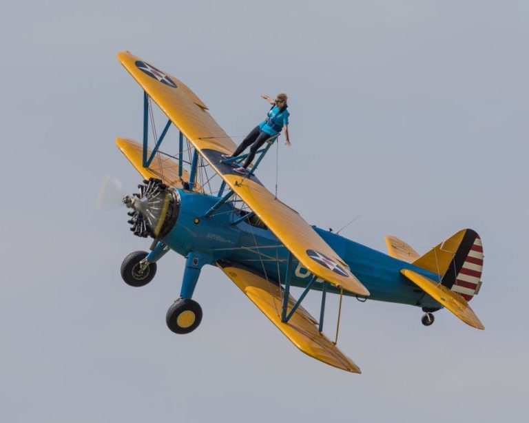 A Skymax Stearman biplane during a Wing Walking challenge