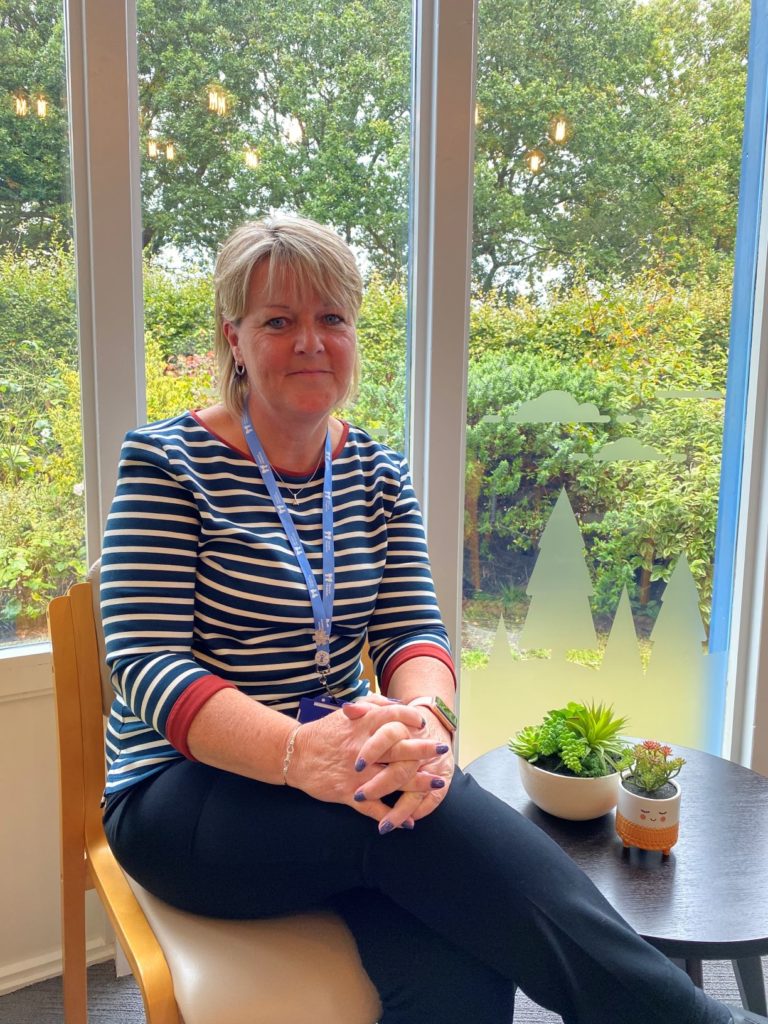 Liz Mell sitting in Sanctuary at Little Havens