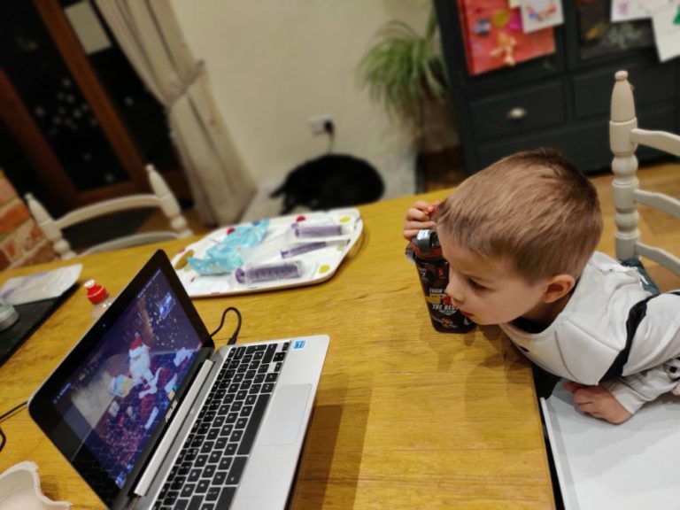 Evie's brother Max watching Santa on Zoom