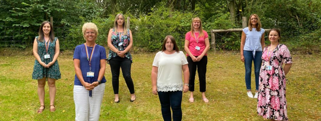 Emma and the children and young people's team stood outside spread apart