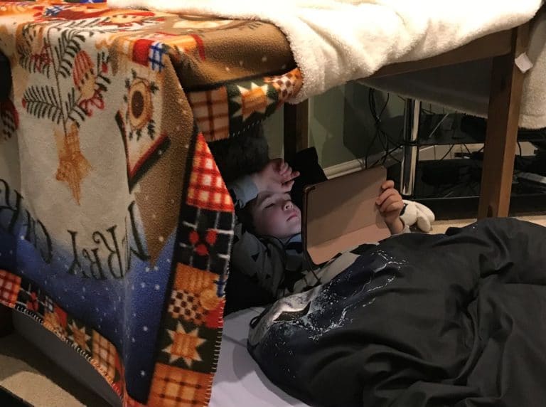 George in his self-built den at home