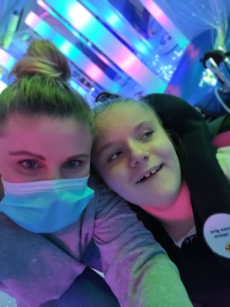 Evie's Mum Sarah and Evie in the multi-sensory room at Little Havens
