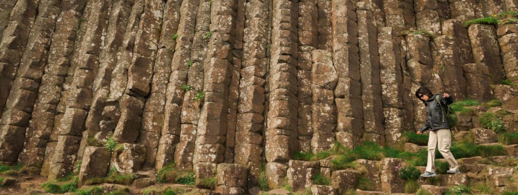 A solo walker, walking on the Giant's Causeway