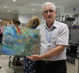 Havens Hospices' Gift To Dr Grahame Tosh A Silk Painting Of The Two Hospices By The Charity's Creative Therapist