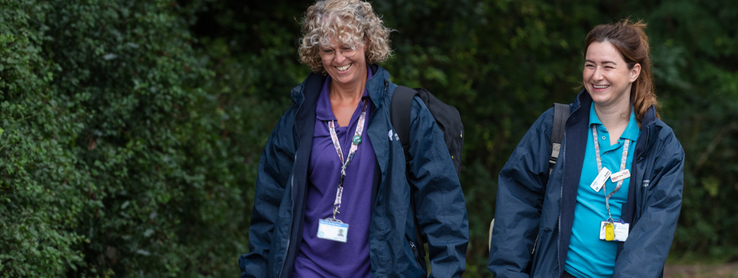 Two nurses walking together outside