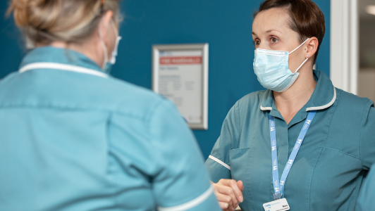 two nurses talking