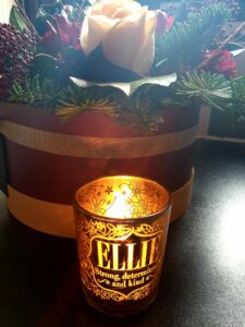 Candle shining in memory of Ellie in December 2020