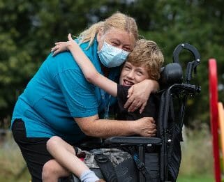 Harry With Nurse Debbie outside in the garden