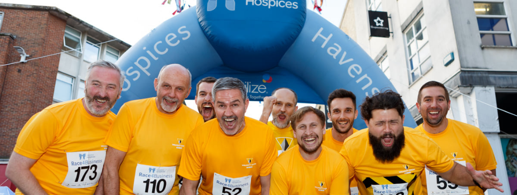 Team of runners in orange t-shirts from Willmott dixon