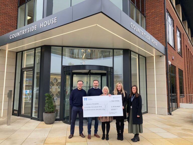 Cheque presentation outside Countryside's offices