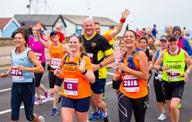 Group of people running the Southend Half Marathon on Southend seafront