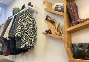 Womenswear section of the new shop in Leigh Road - shoes section and clothing rail