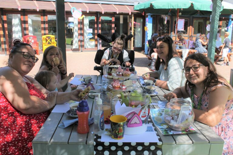 Families Enjoying Afternoon Tea At Little Havens