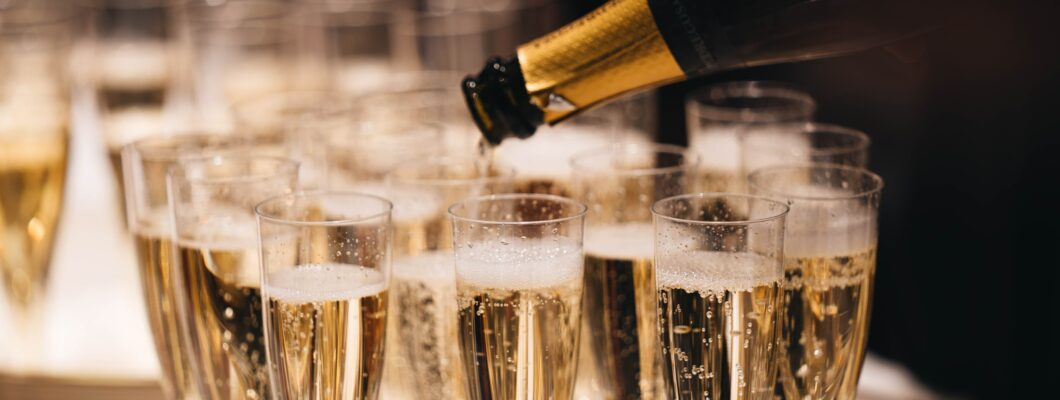 a tray of champagne glasses