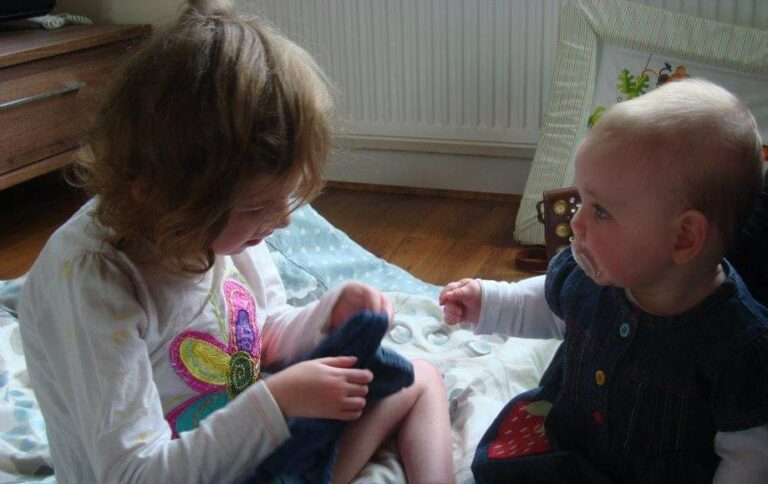 Two young children playing together