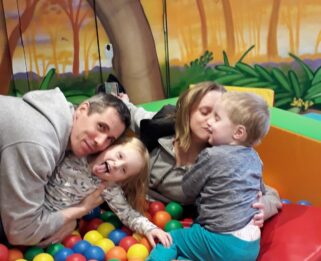 Noah, with mum dad and sister in ball pit