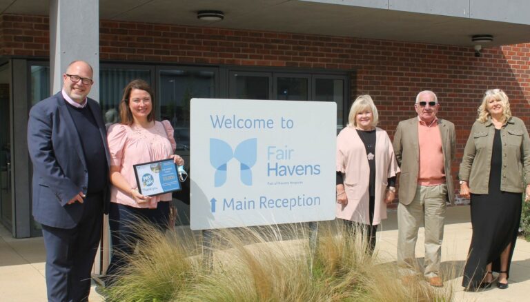 Family standing outside hospice
