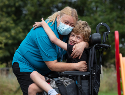 Harry With Nurse Debbie outside in the garden
