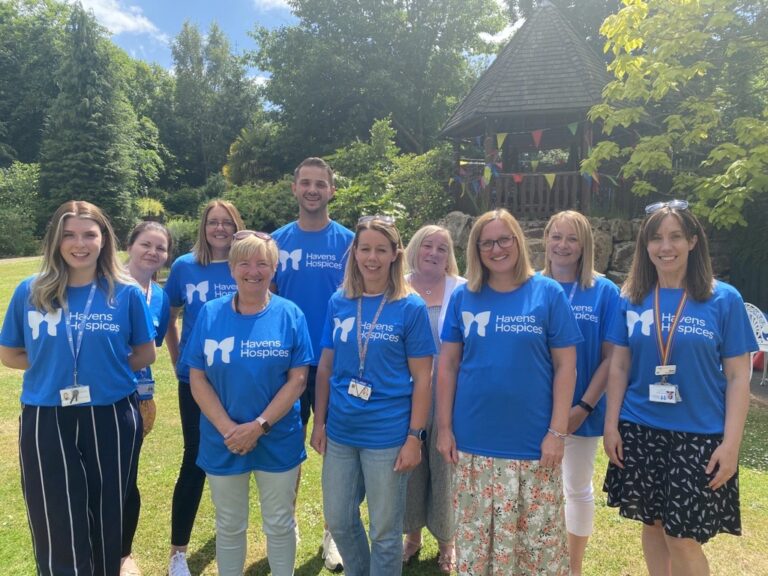 Care Team at Little Havens in the hospice gardens with Havens Hospices t-shirts