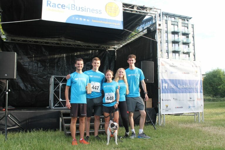 Group of colleagues in front of the stage at Race4Business event