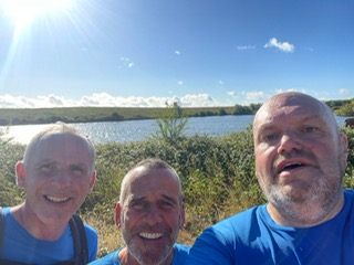three men in Havens Hospices t-shirts on a training run