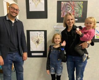 Aron, Dottie, Jen and Norah standing in front of artwork