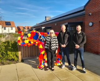 Cllr Carole Mulroney, Liam Cousins, Tom Duke standing in front of patchwork elephant