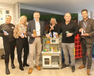 Representatives from Little Havens and Tapp'd cocktails at Little Havens holding tapp'd bottles and a cocktail shaker