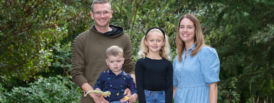 Ellis stood outside with his family, sister Freya and parents