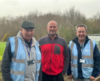 Douglas Barnes, Paul Samways and Neil Oakley standing in the allotment at Little Havens