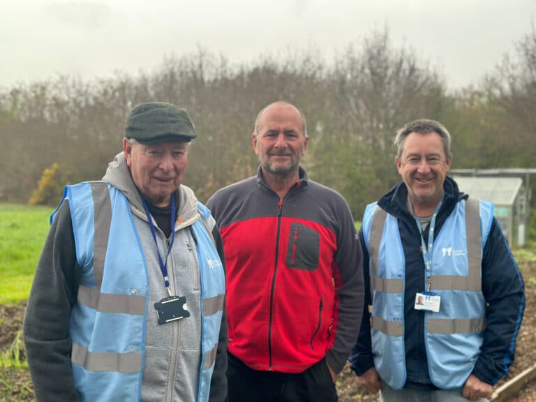 Douglas Barnes, Paul Samways and Neil Oakley standing in the allotment at Little Havens