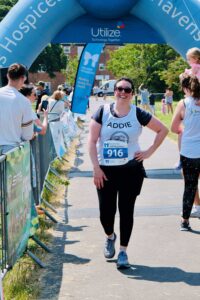Adrienne Treeby smiling at the finish line of the Southend Half Marathon