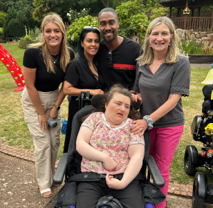 Simon and his wife Ayshen stood outside with teenage girl sophie and her family