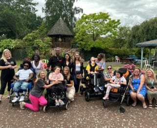 Simon and Ayshen Webbe with families in the garden of Little Havens