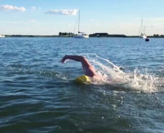 man swimming in water