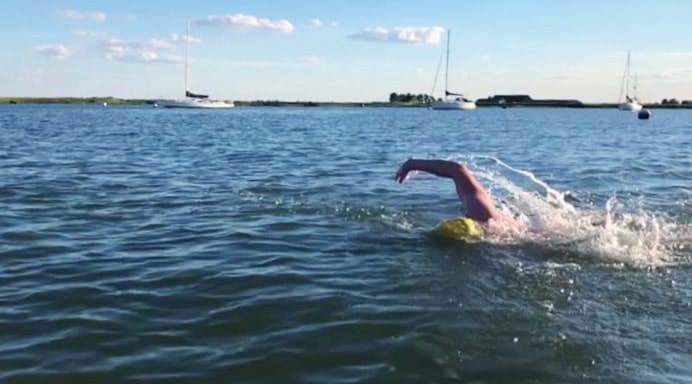 man swimming in water