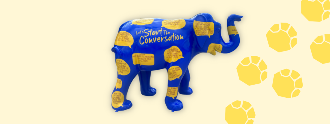 Elephant in the room elephant on a yellow background with yellow footprints going behind it
