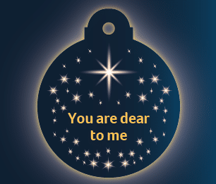 A navy blue bauble with stars and text that says you are dear to me