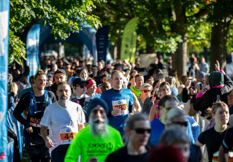 Runners in Chelmsford's Central Park after just starting the race