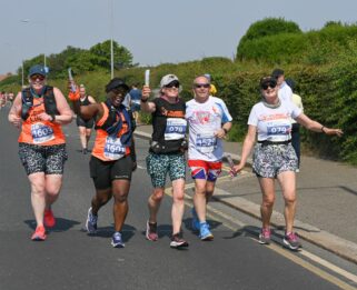 People smiling, running in Havens Hospice Southend half marathon.